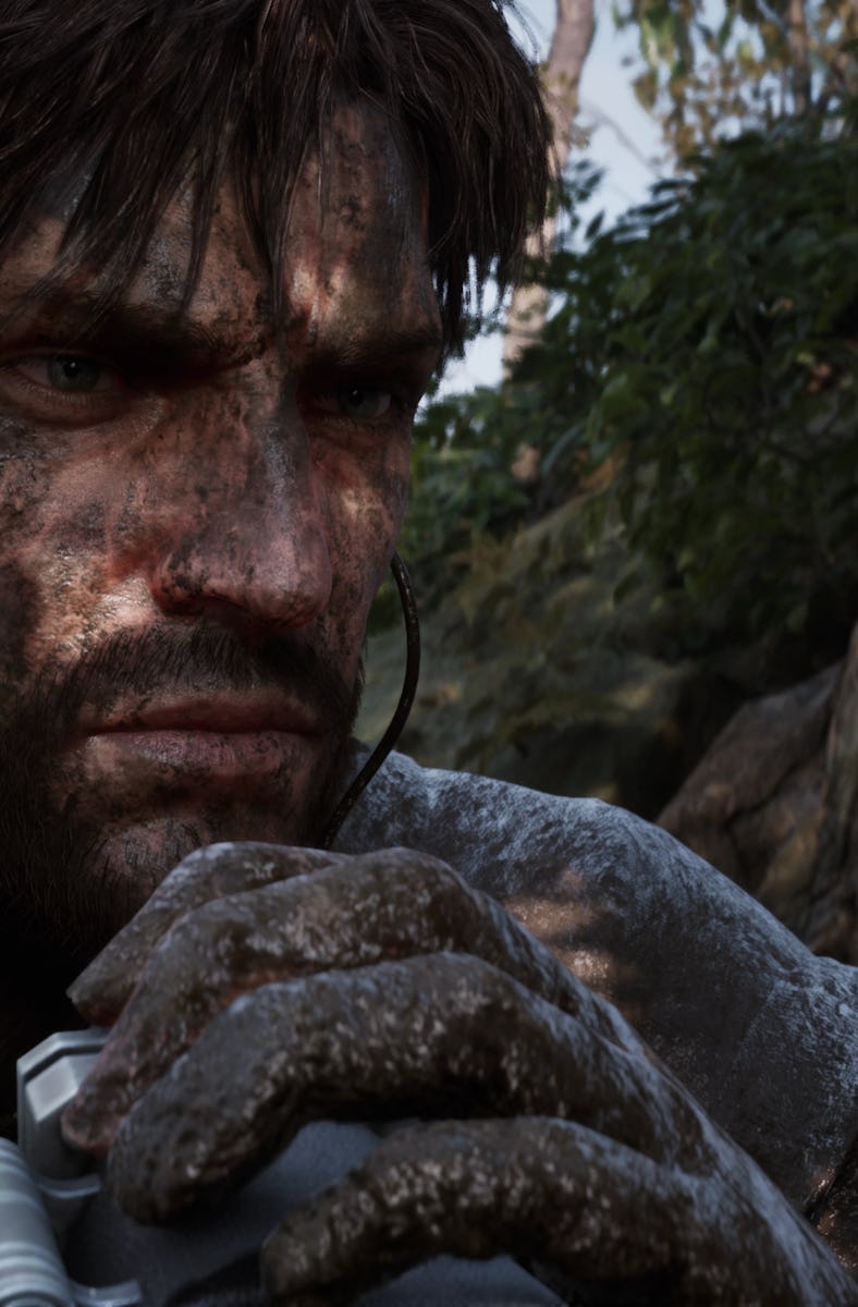 Snake preps his binoculars covered in mud.