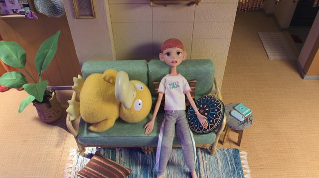 Psyduck lays on a couch exhausted in a screen grab from pokemon concierge, new episodes of which are...