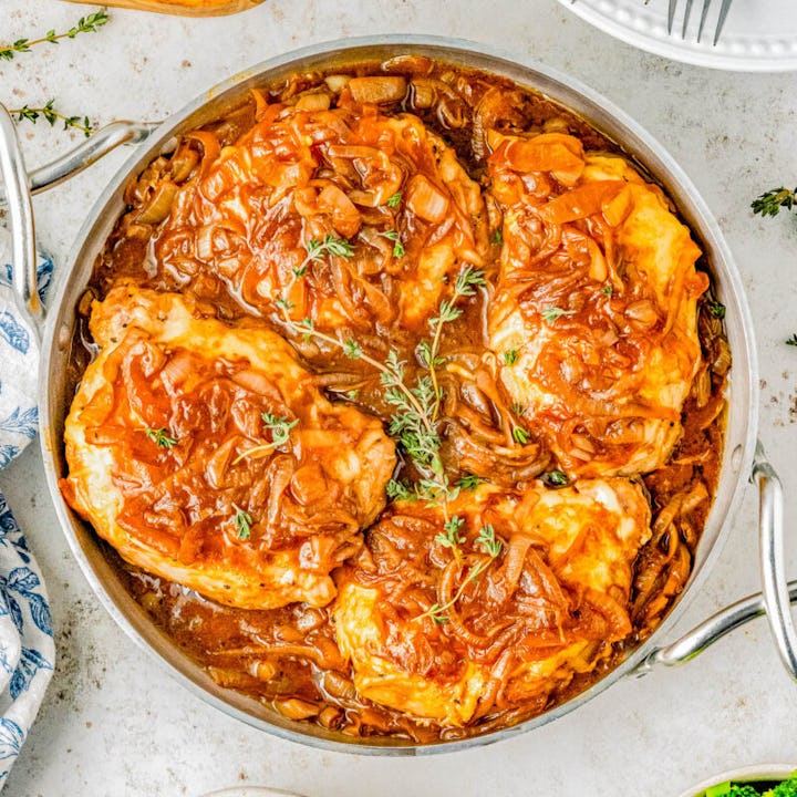 french onion pork chops in a serving dish, in a story about easy pork chop recipes