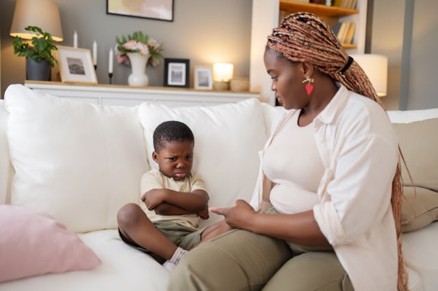 A mom calms her young son, who is having a meltdown.