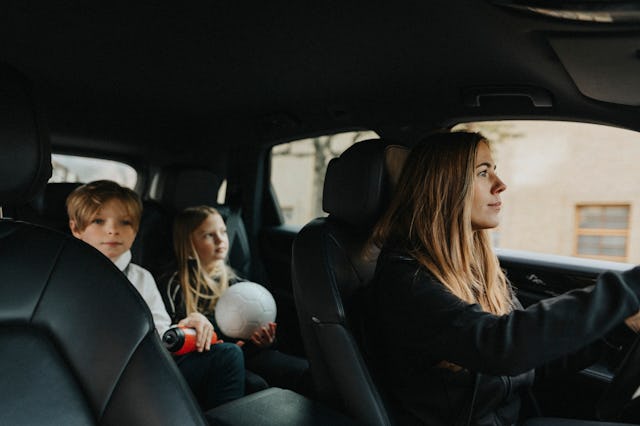 A mom in the car with her kids