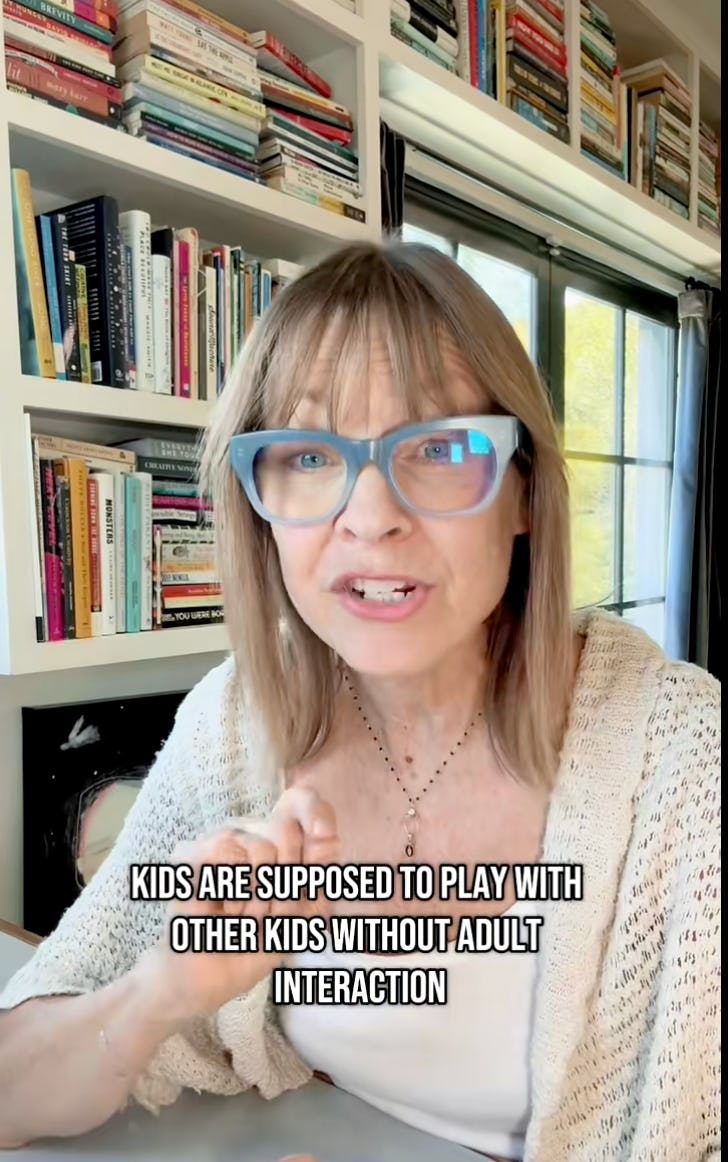 A woman with glasses passionately discusses children's play, emphasizing the importance of kids interacting without adult involvement. Bookshelves are visible in the background.