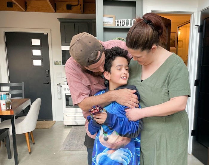 Gabby Emery and her fiancé with her son, Roman