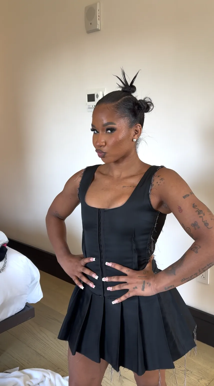 jordan chiles wore a shirt-dress and thigh-high boots all day, everyday, we ballin' 