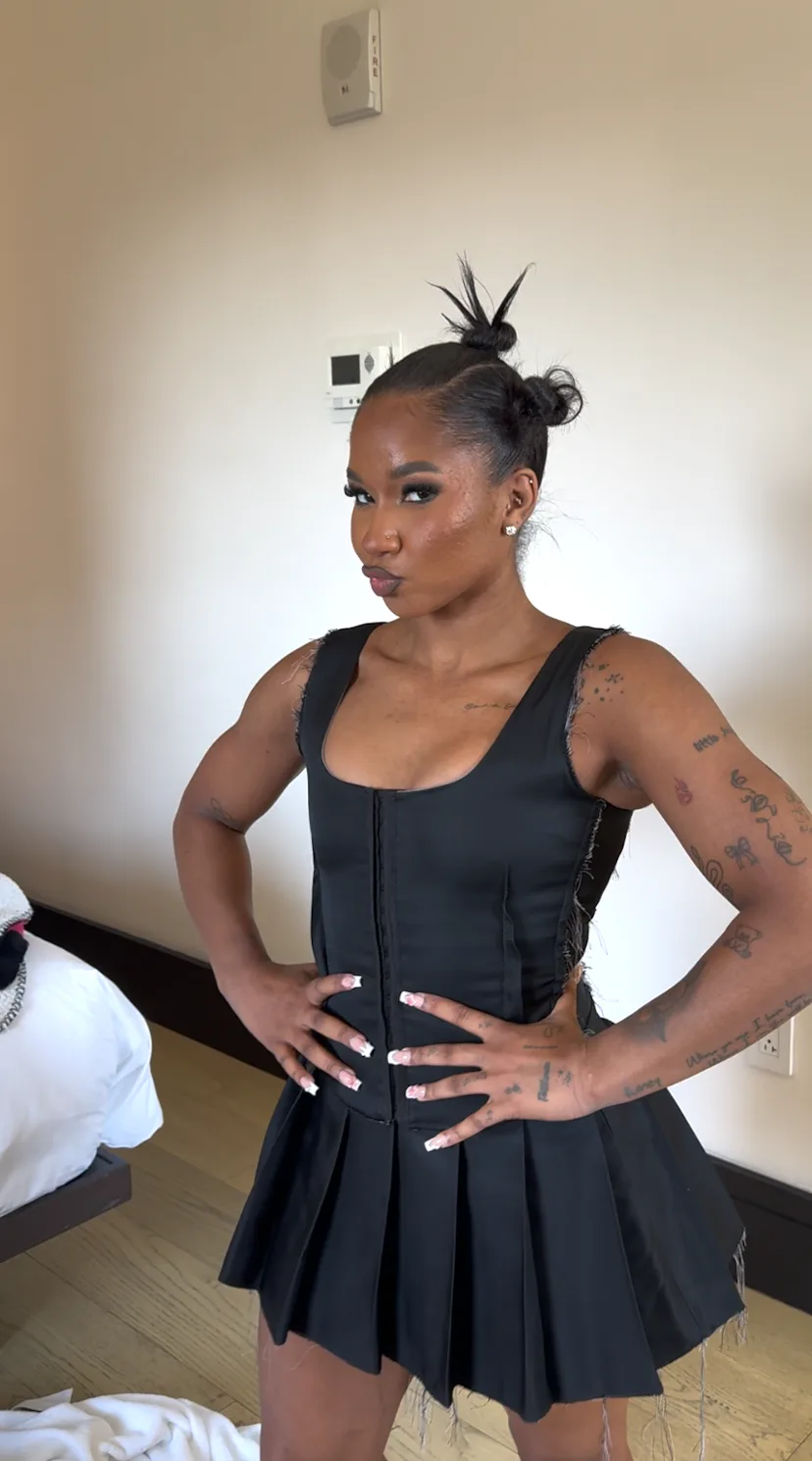 jordan chiles wore a shirt-dress and thigh-high boots all day, everyday, we ballin'