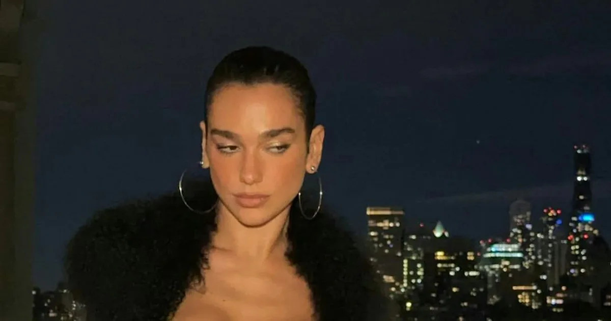 Dua Lipa's Penny Lane Coat Comes With a Lingerie Twist
