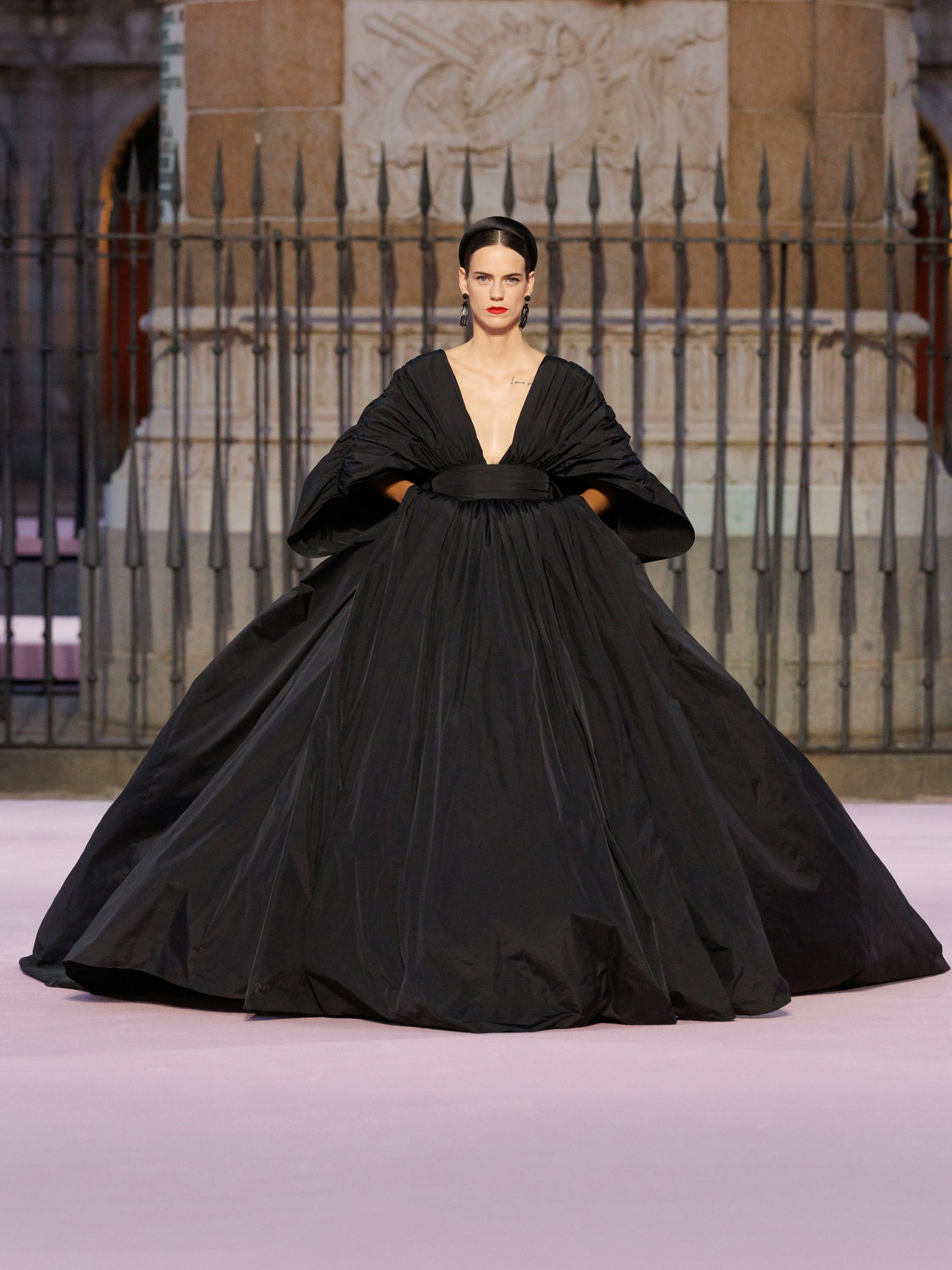 Model walks the Carolina Herrera runway in Madrid's Plaza Mayor
