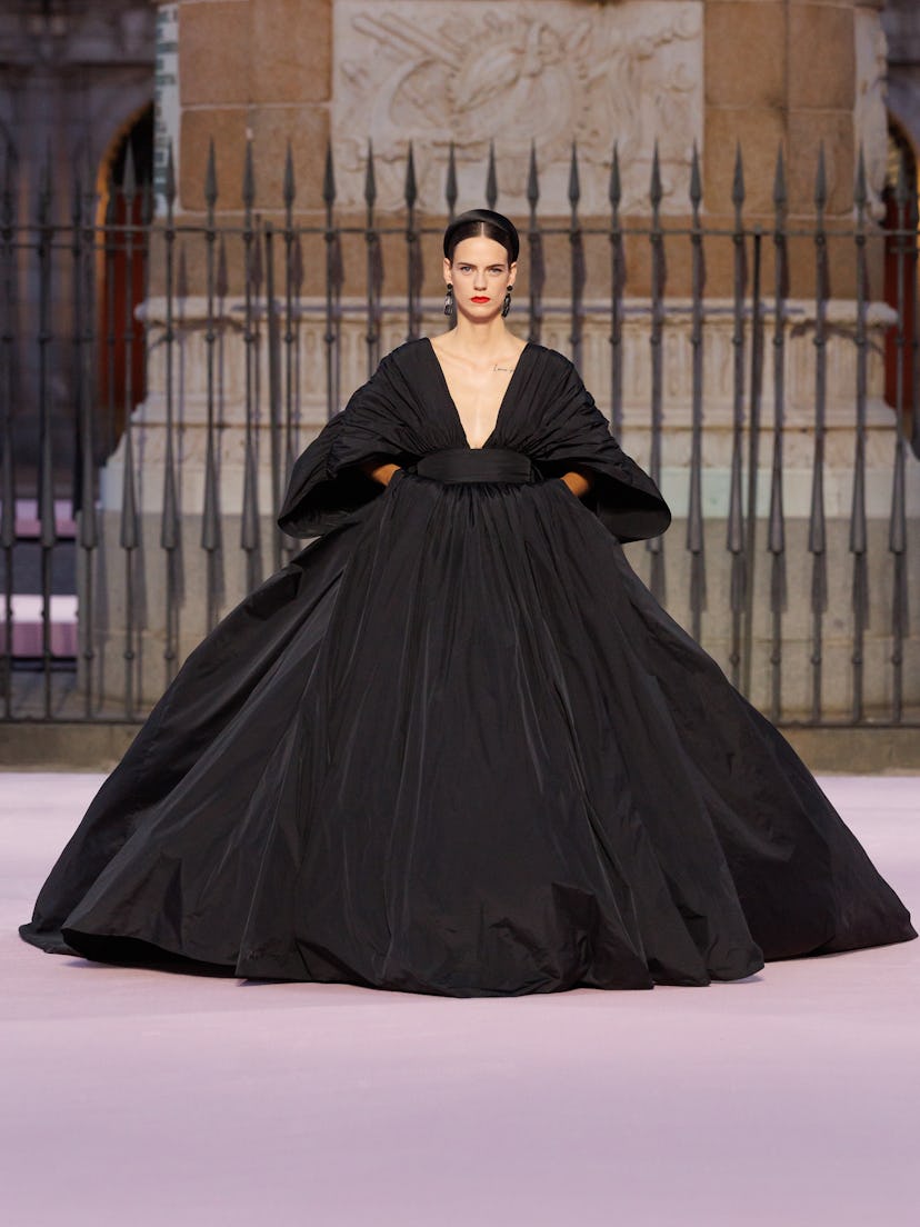 Model walks the Carolina Herrera runway in Madrid's Plaza Mayor
