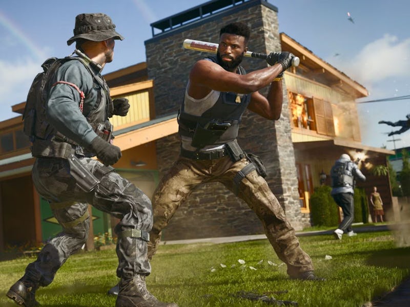 Two men in tactical gear and casual attire face off in a suburban yard, while a house behind them is...