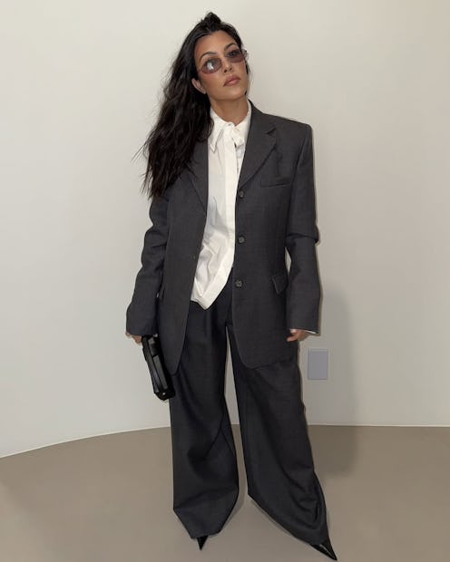 Kourtney Kardashian's wispy bangs are giving rockstar girlfriend.