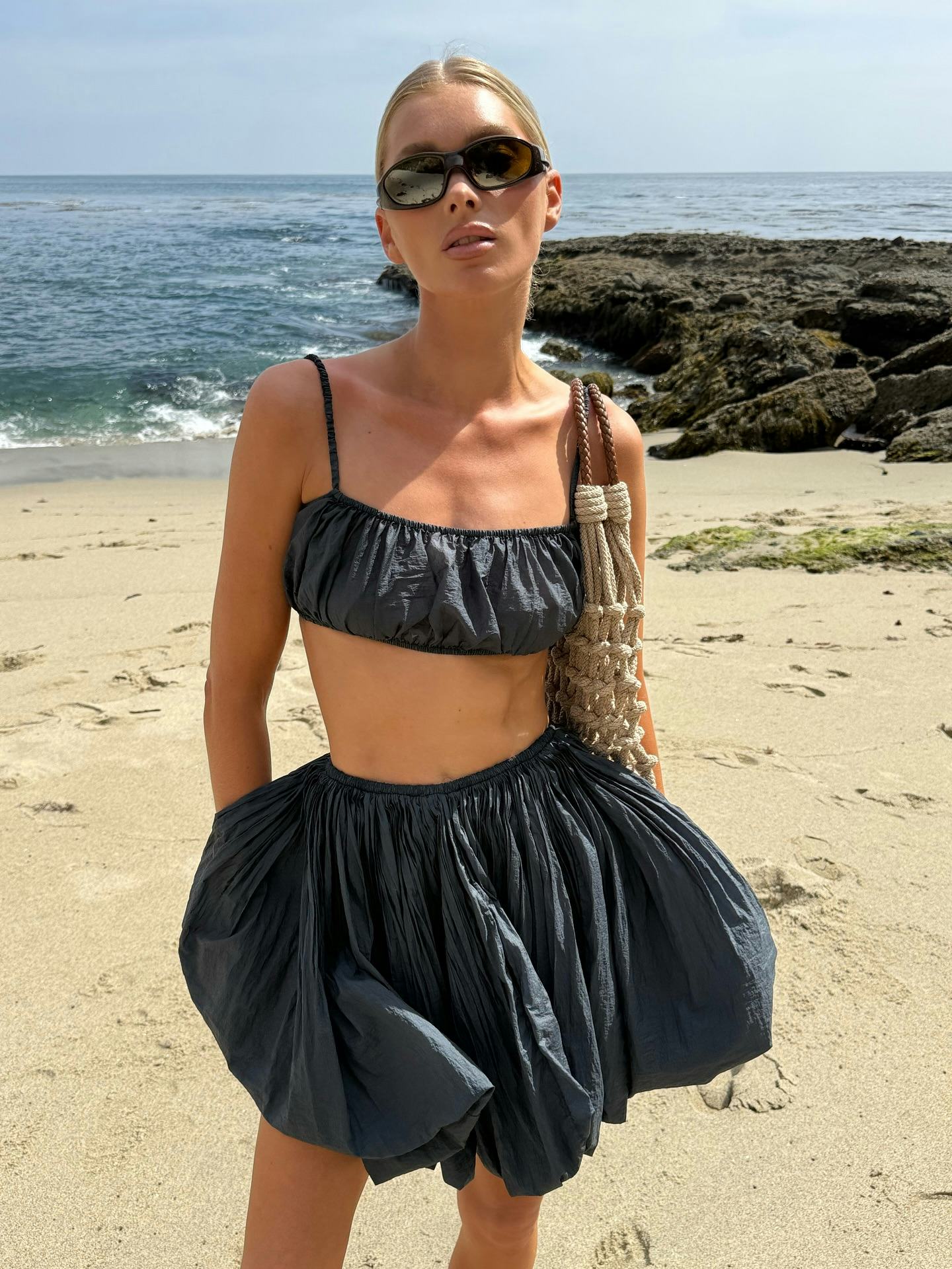 Elsa Hosk wears a bralette and skirt. 