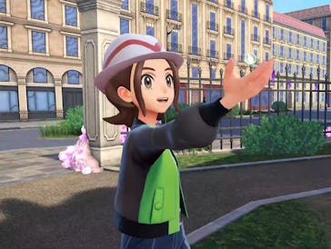 A Z-A player holds out an item.