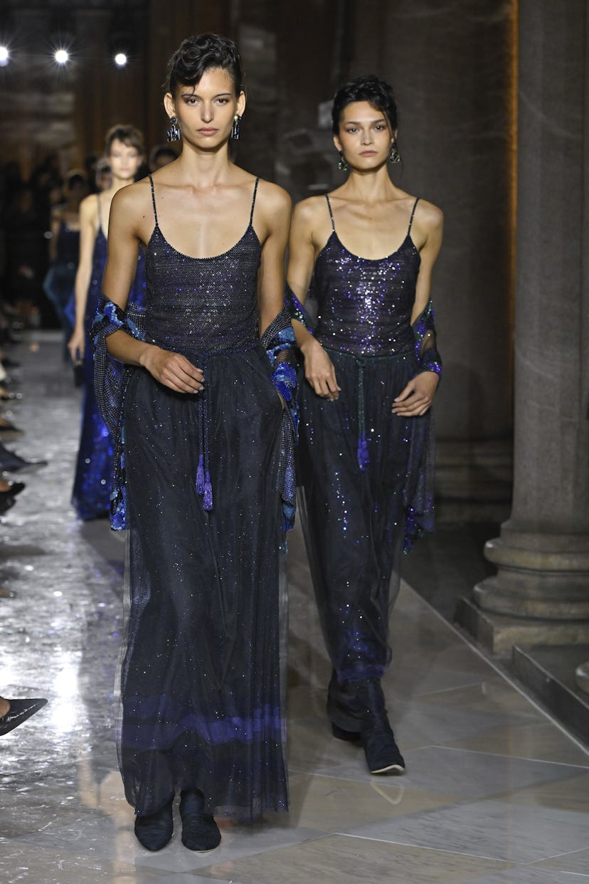 A model walks the runway during the Giorgio Armani Ready to Wear Spring/Summer 2026 fashion show as...