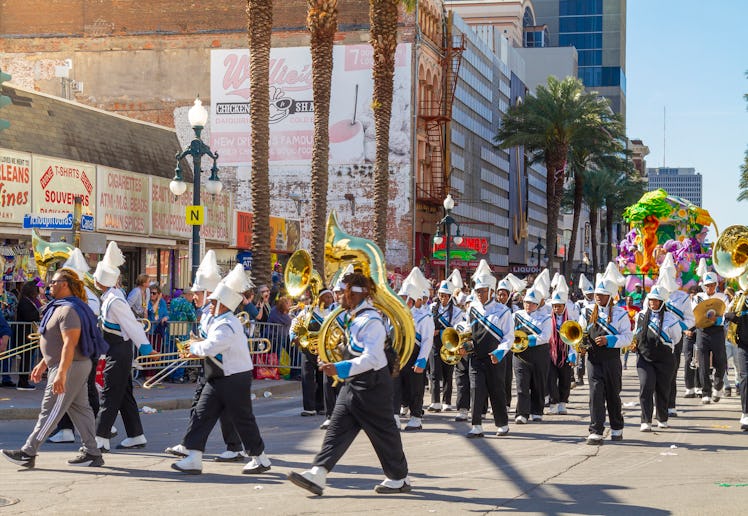 A group of musicians during the parade along Canal street on Mardi Gras Day. Mardi Gras' celebration...