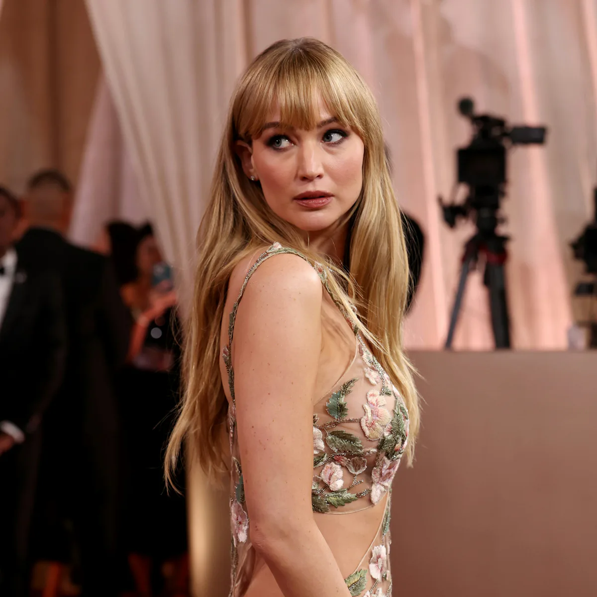 jennifer lawrence gold dress flowers Jennifer Lawrence's Sheer 2026 Golden Globes Dress Is Her Riskiest Look Yet