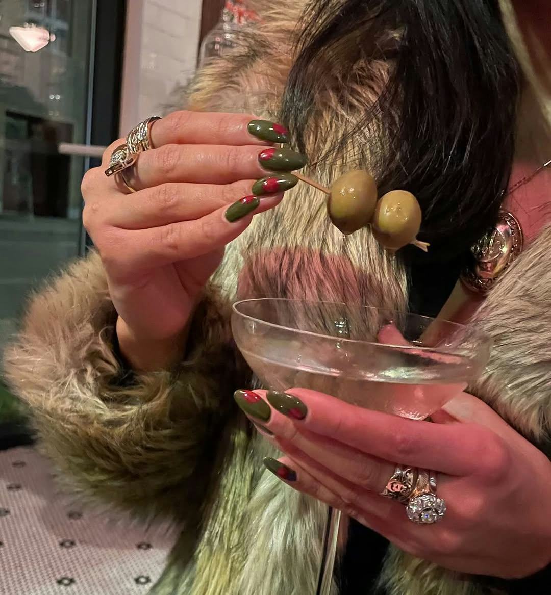 Olive nail art brings dirty martini vibes to your fingertips.