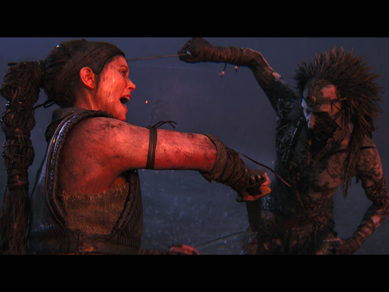 Senua engages in intense combat with a monstrous figure in a dark, misty environment.