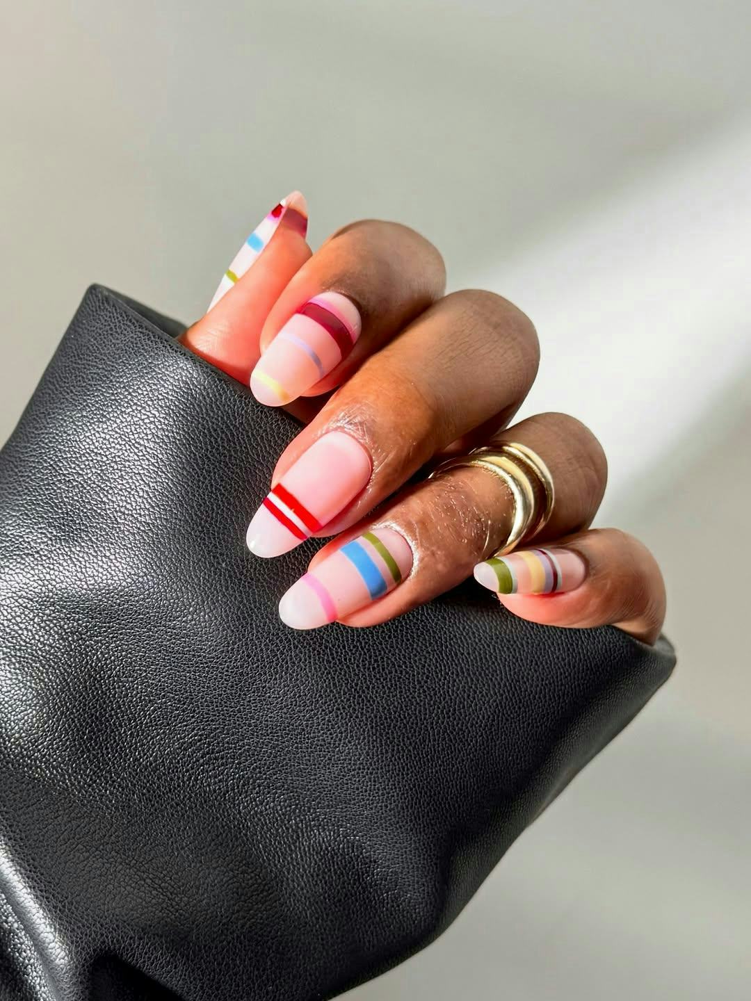 20 striped nail ideas that are fun, vibrant, and colorful.