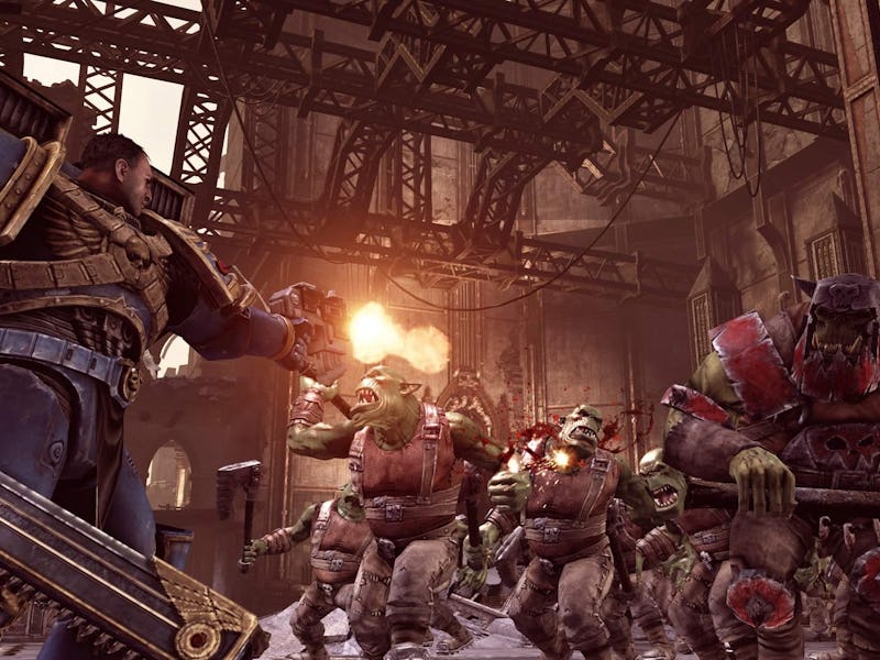 Titus fires a bolt pistol at Orcs.