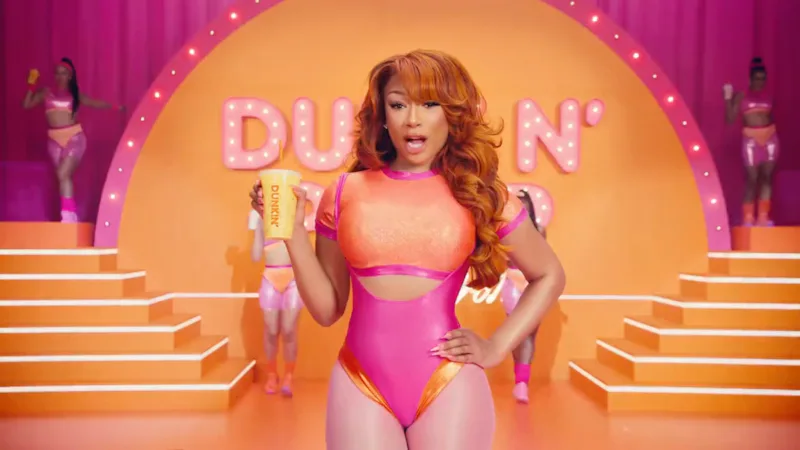 Megan Thee Stallion's wore an '80s-era bodysuit with cutouts for a Dunkin' ad.