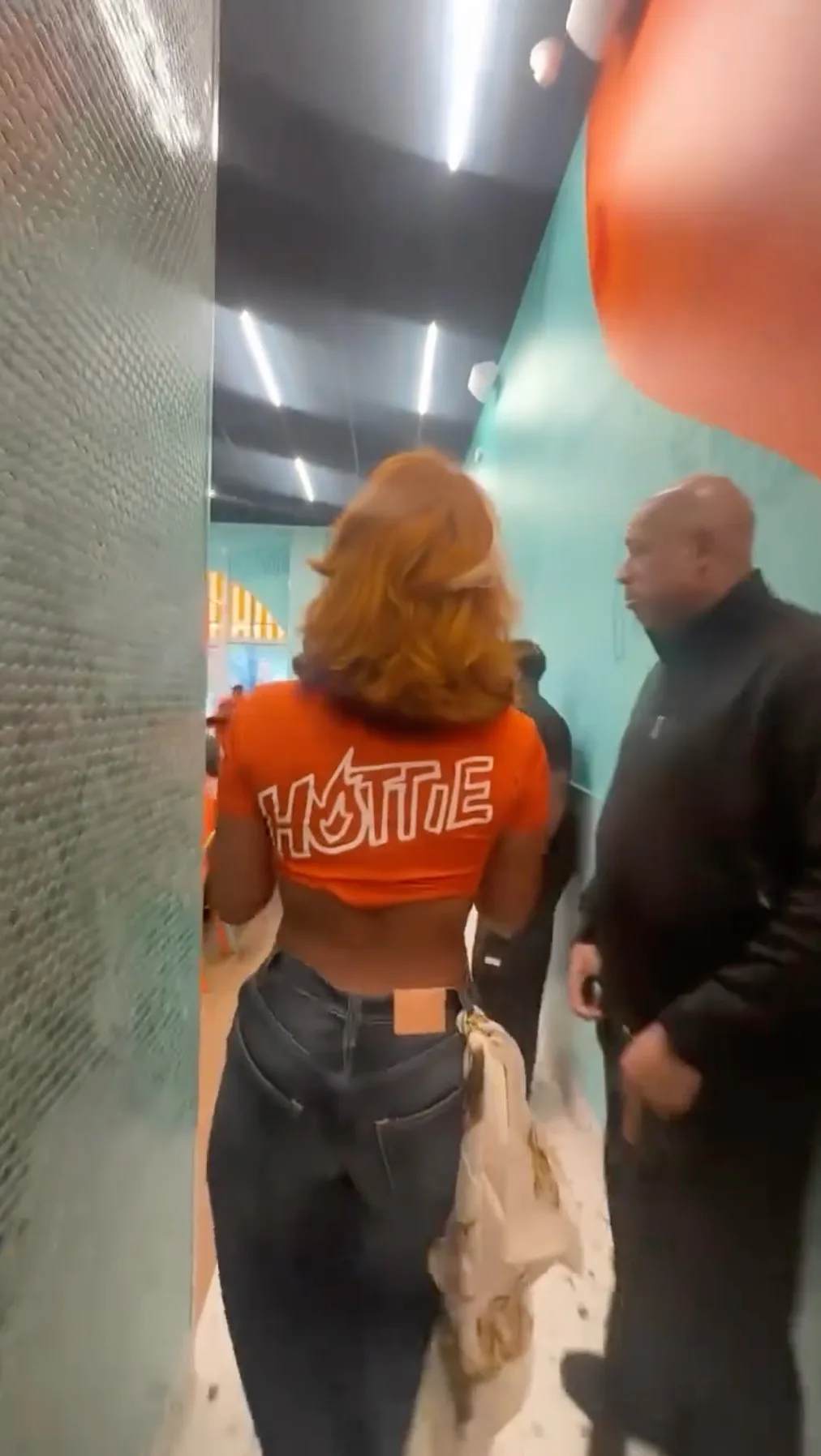 Megan Thee Stallion's wore an '80s-era bodysuit with cutouts for a Dunkin' ad.