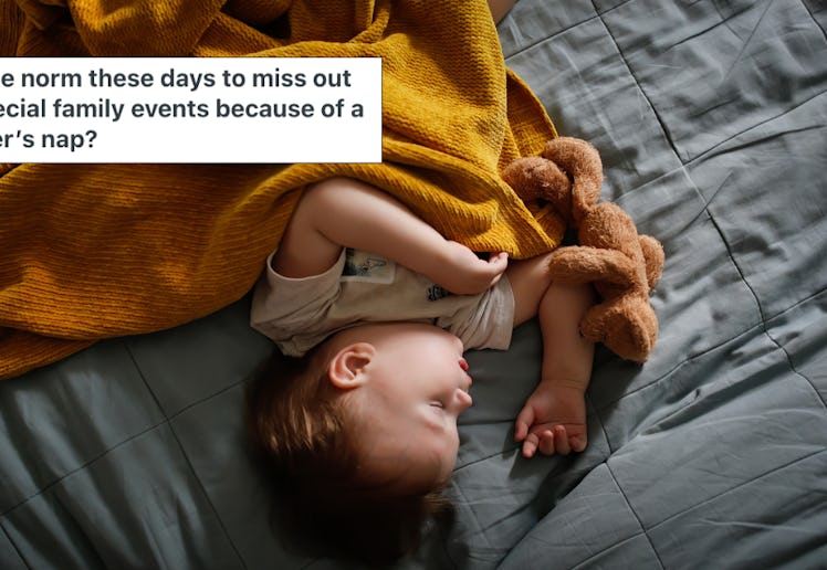 A toddler sleeps on a bed, wrapped in an orange blanket.