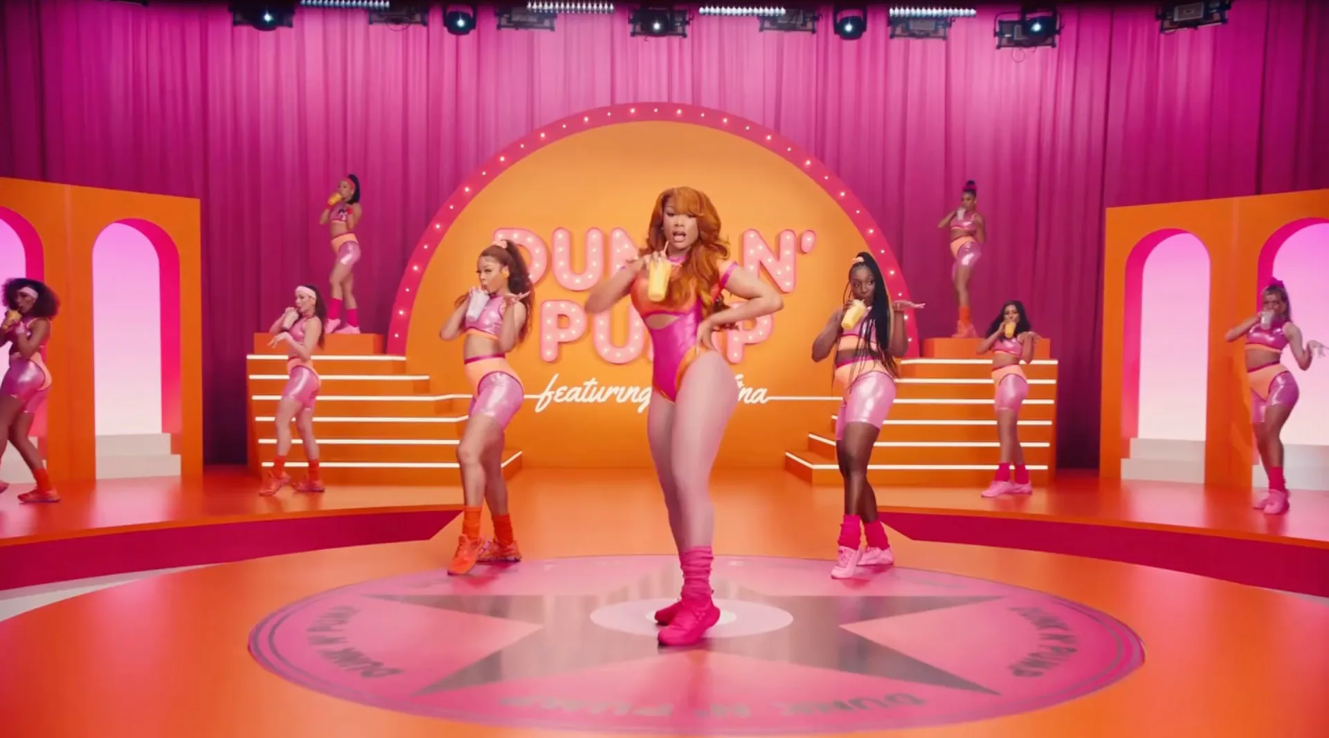 Megan Thee Stallion's wore an '80s-era bodysuit with cutouts for a Dunkin' ad.