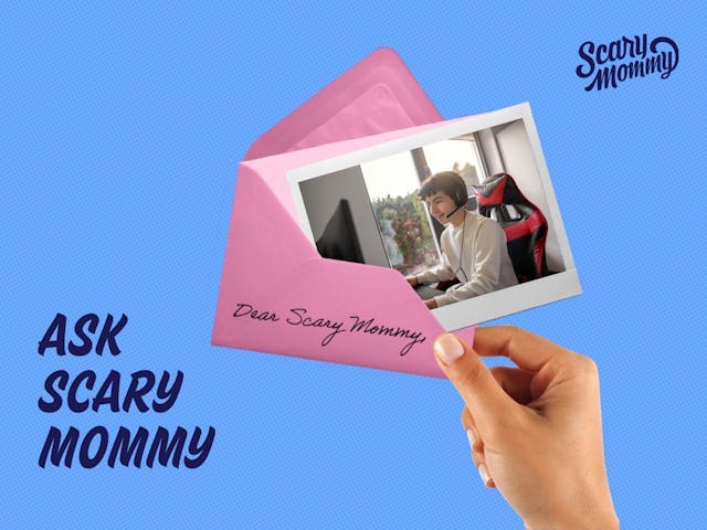 A picture of a teenaged boy playing on a computer, pushed halfway into an envelope.