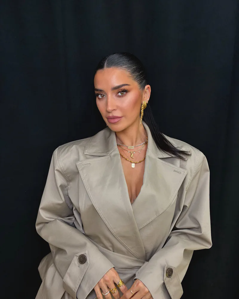 Nicole Williams English in a trench coat
