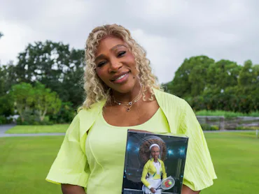 Serena Williams poses with her new Barbie doll