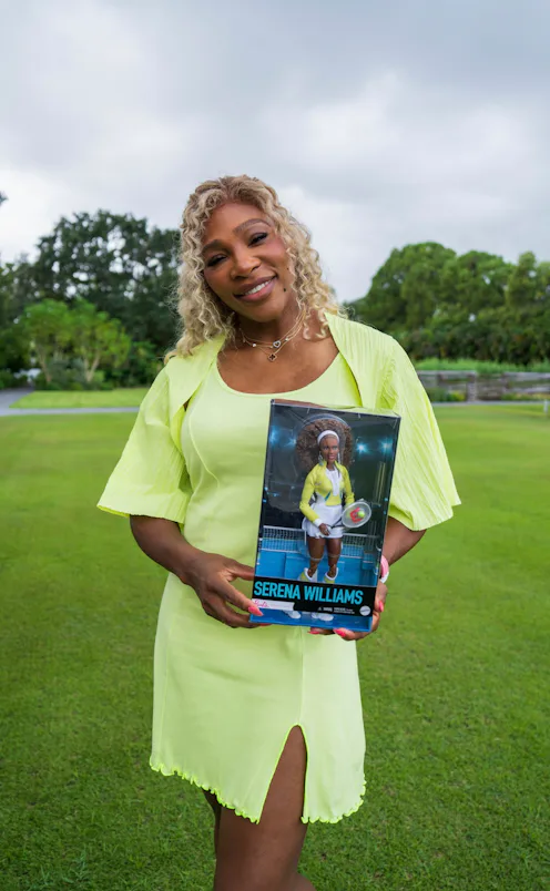Serena Williams poses with her new Barbie doll