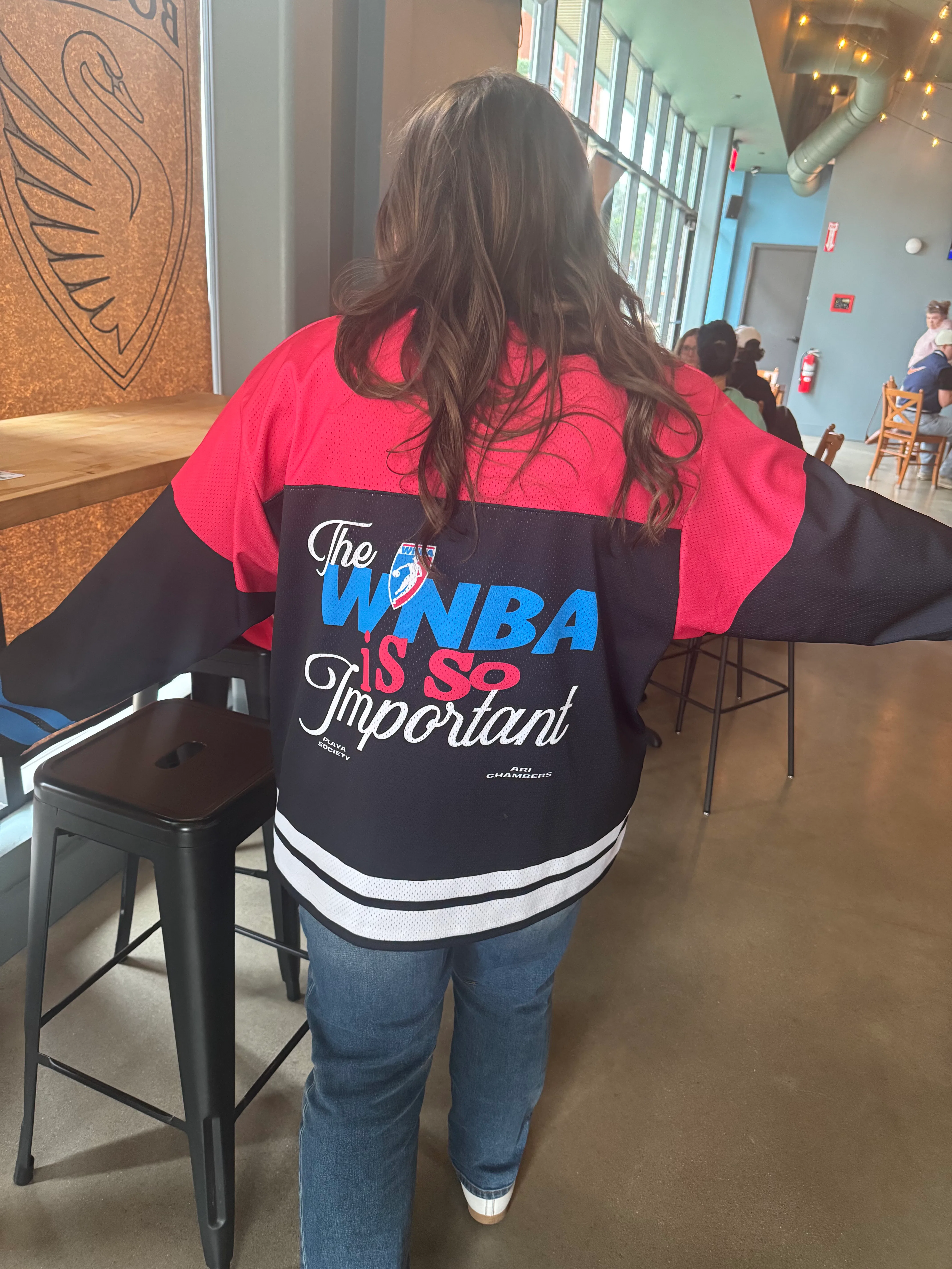 The woman in the WNBA jersey — which, it turns out, she bought at the WNBA All-Star Game in Chicago ...