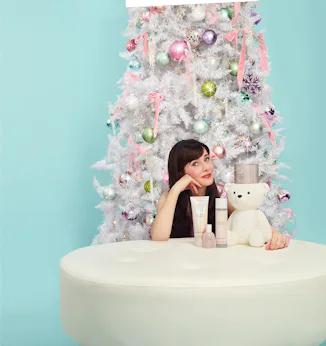 Zooey Deschanel dishes on her favorite holiday movie, scents, and traditions.