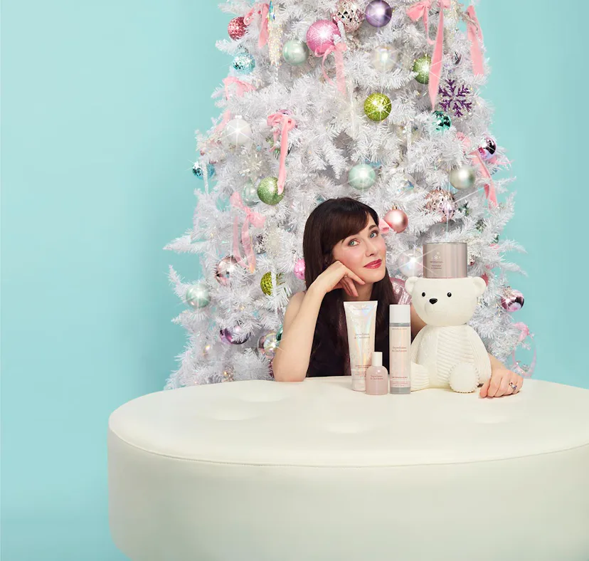 Zooey Deschanel dishes on her favorite holiday movie, scents, and traditions.