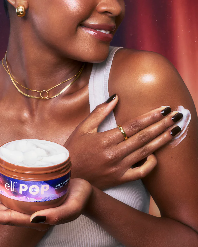 model swiping e.l.f. spicy bundt nice body cream on her arm