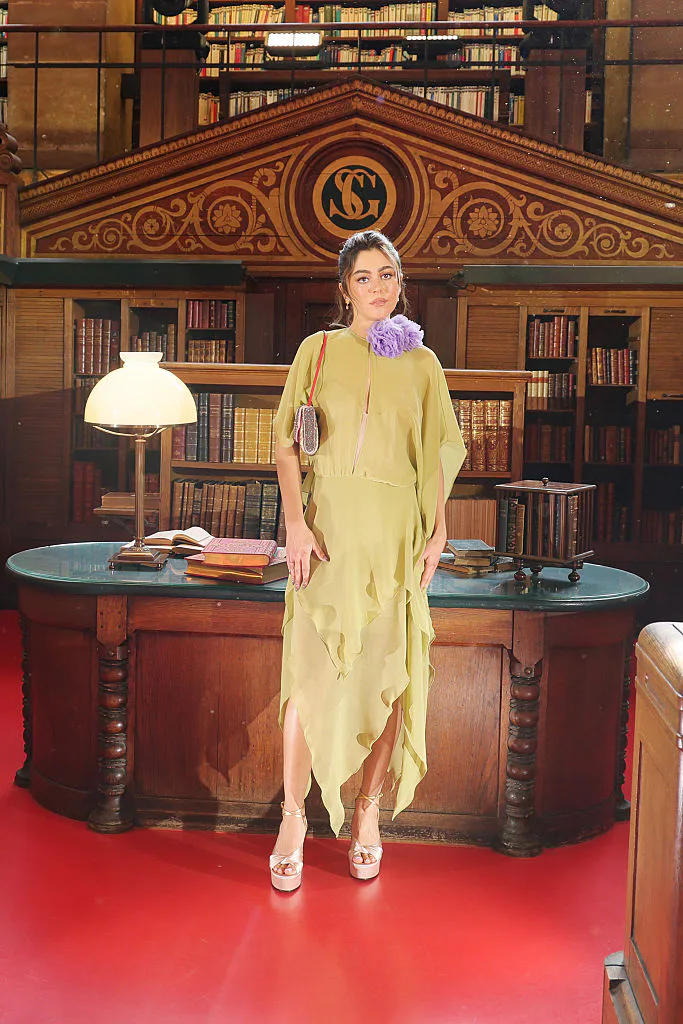Mika Abdalla at Paris Fashion Week wearing Valentino.