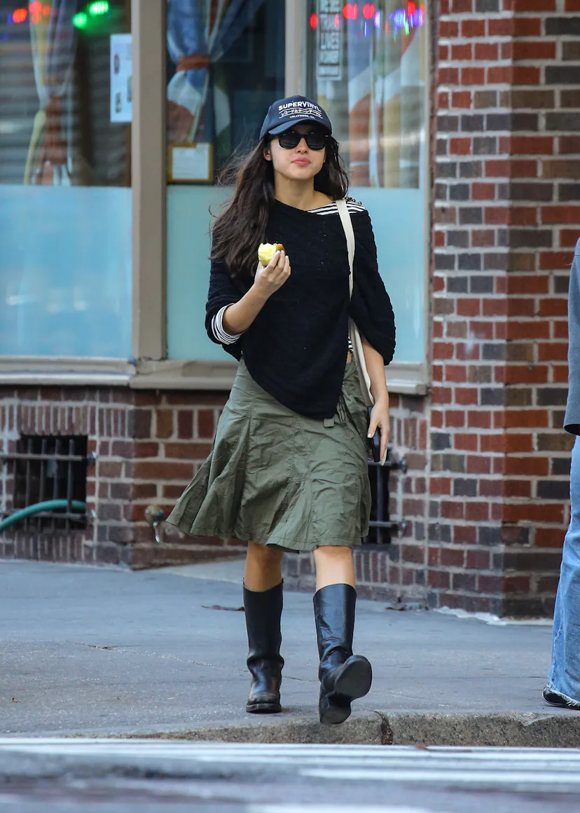 Olivia Rodrigo takes a casual stroll in New York City while eating an apple.