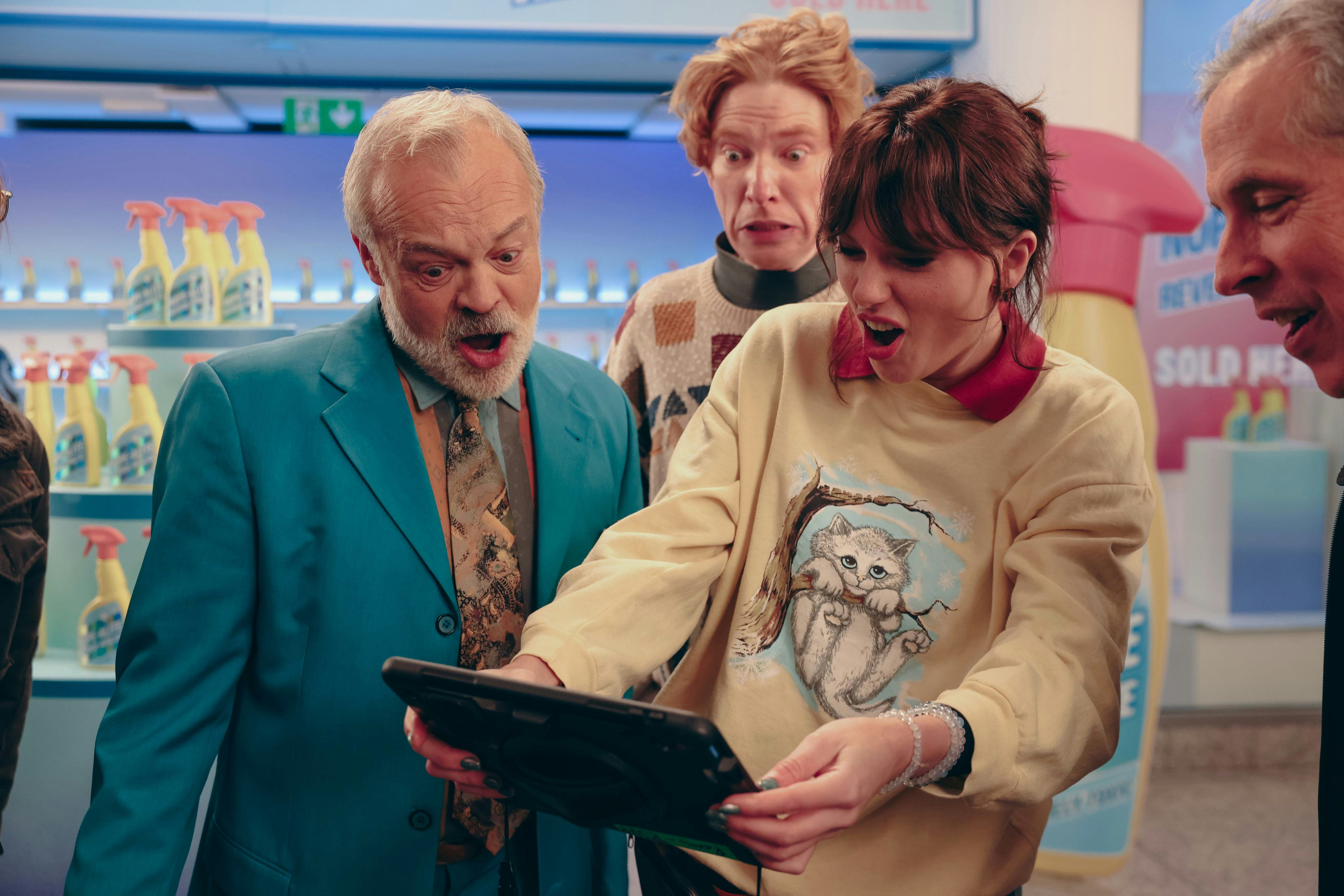 Graham Norton, Domhnall Gleeson, and Taylor Swift in "Opalite" extended video. Photo via Taylor Swif...