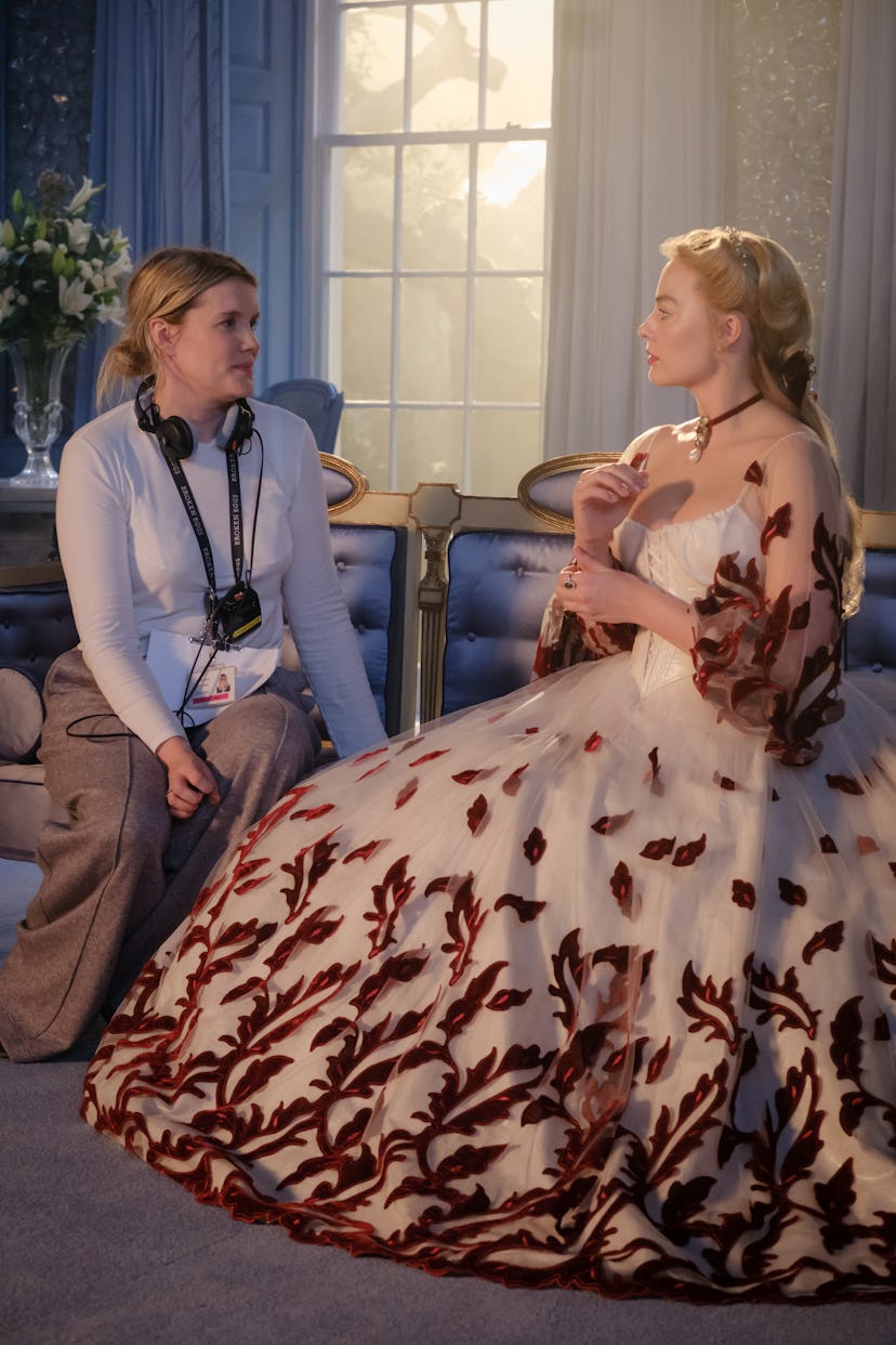 Emerald Fennell with Margot Robbie on the set of 'Wuthering Heights.' Courtesy of Warner Bros.