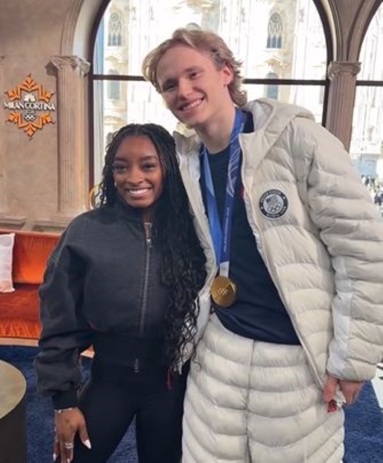 Simone Biles surprised Ilia Malinin by crashing an interview at the 2026 Milano Cortina Olympics.