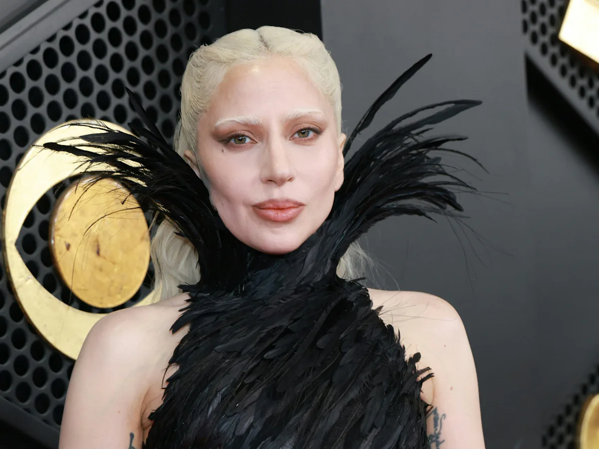 lady gaga feather dress Wearing a black, ruffled feather gown by Matires Fcales, Lady Gaga brought drama and glamor to the Grammys red carpet. See link below