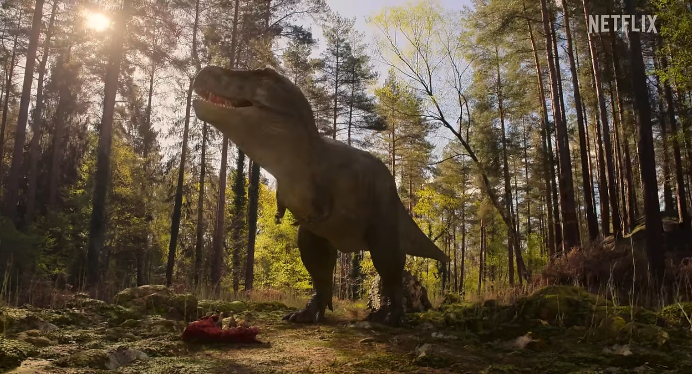 CGI T-Rex stands in a clearing in a screengrab from Netflix's The Dinosaurs, a new family-friendly m...