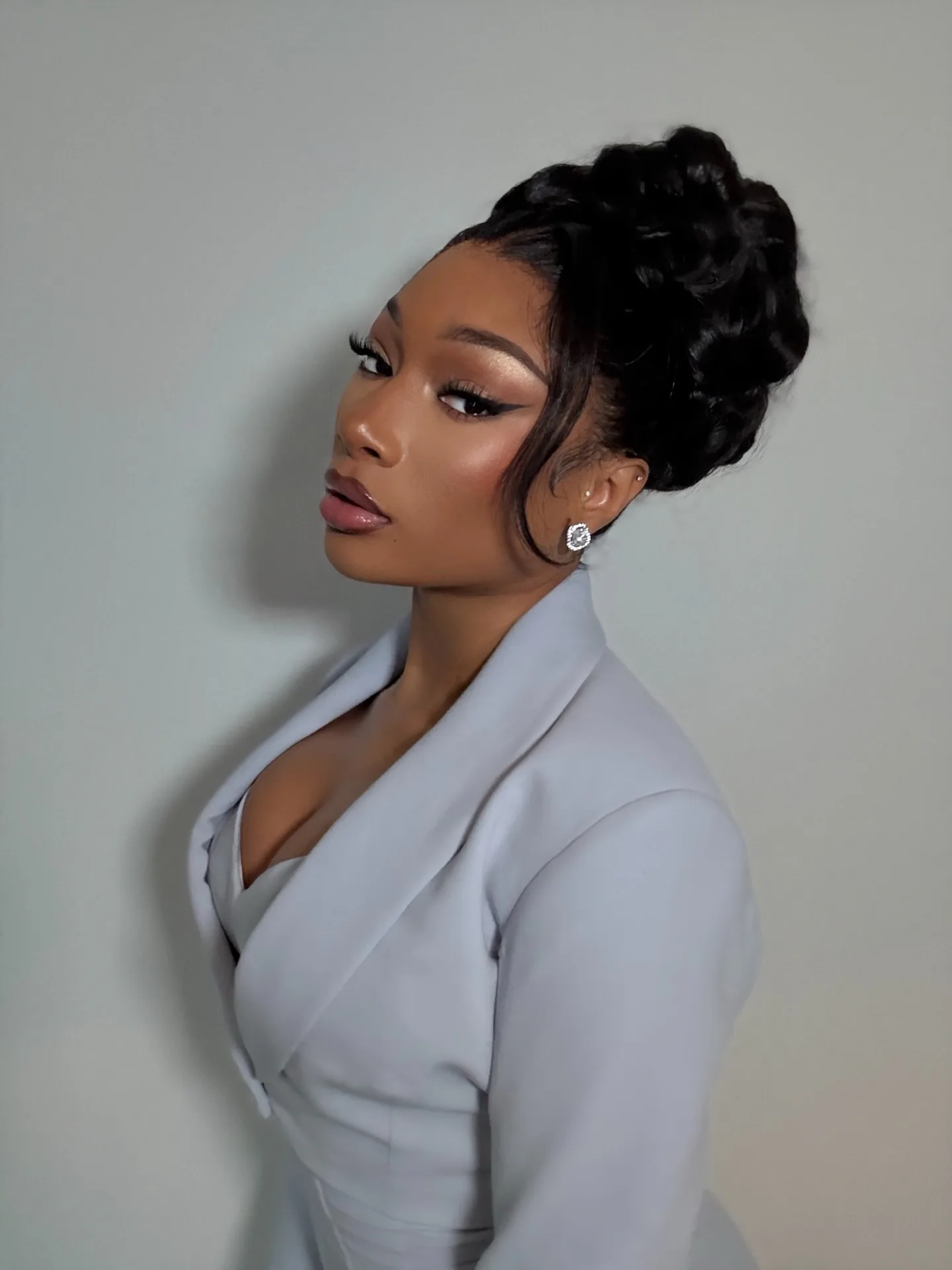 Megan Thee Stallion with a prom updo