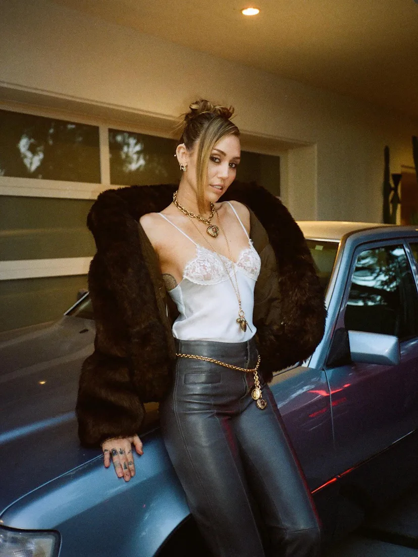 Miley Cyrus with a prom '90s updo