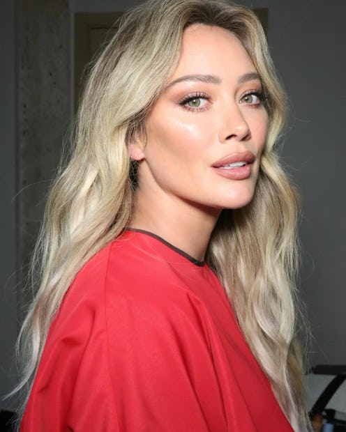 Hilary Duff looking at the camera in glowy makeup