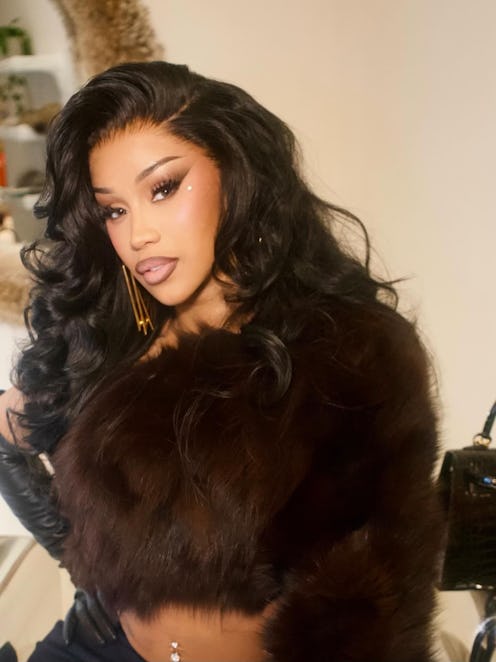 Cardi B with glam makeup and bombshell hair