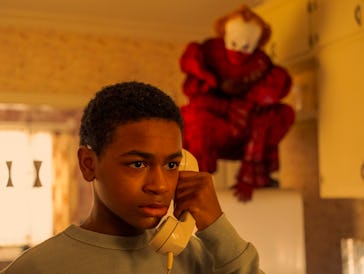 Blake Cameron James and Bill Skarsgård in It: Welcome to Derry