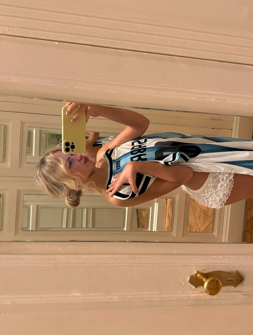 Sabrina Carpenter wears a jersey.