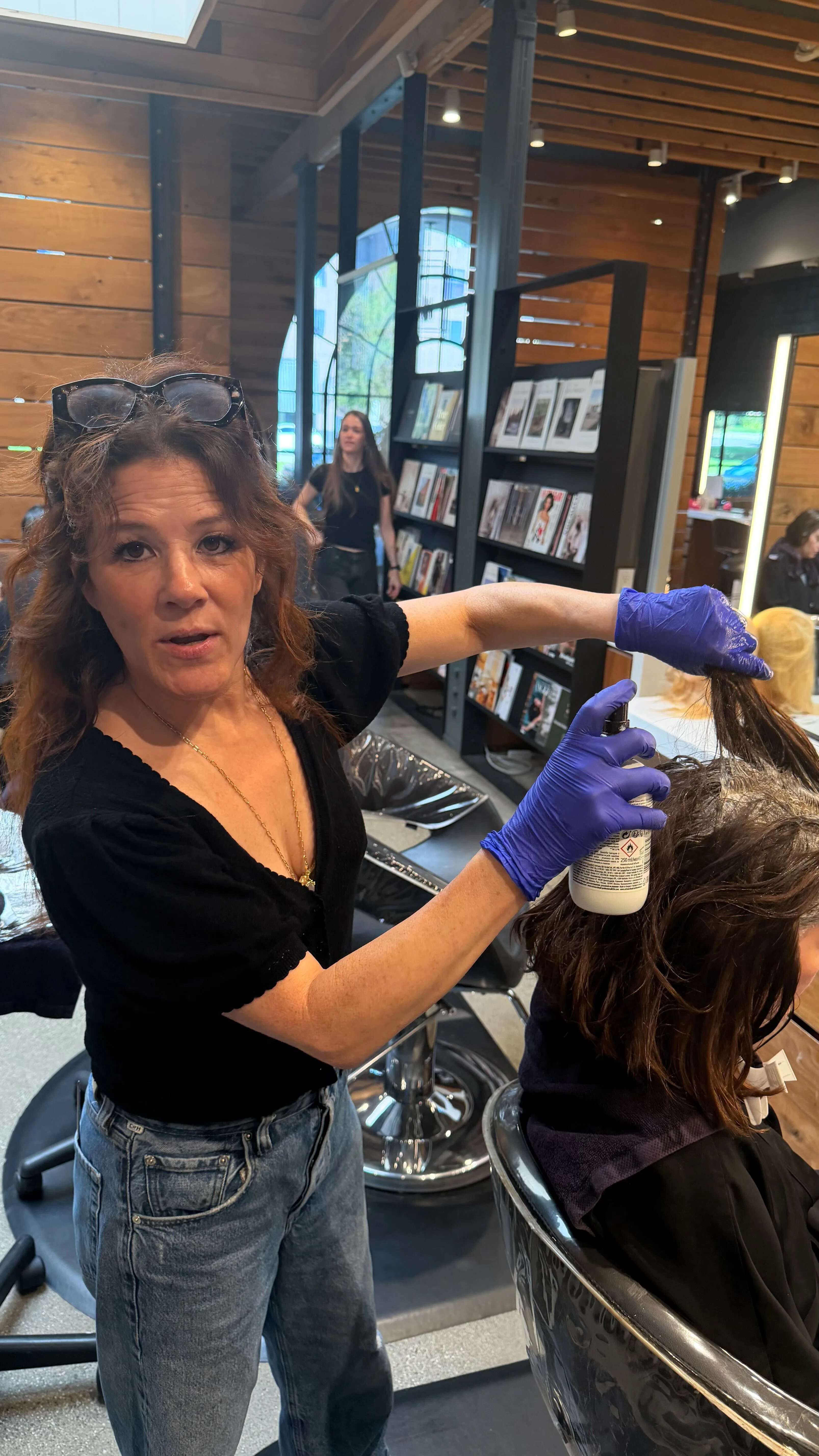 Zoey Deutch in the chair as Tracey Cunningham colors her hair