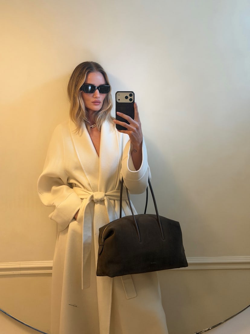 Rosie Huntington-Whiteley wears a cream outfit.